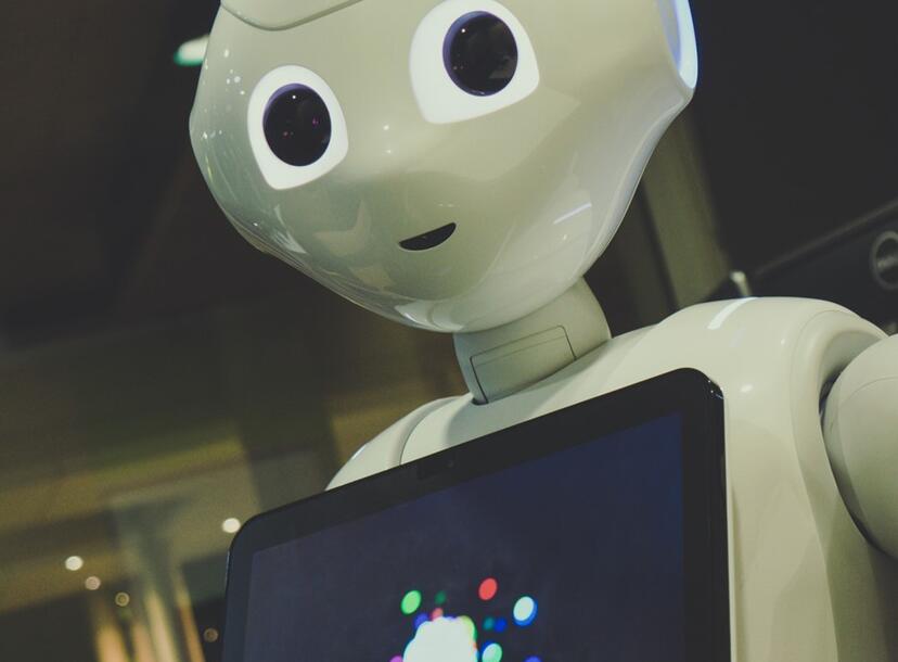 AI robot holding Ipad